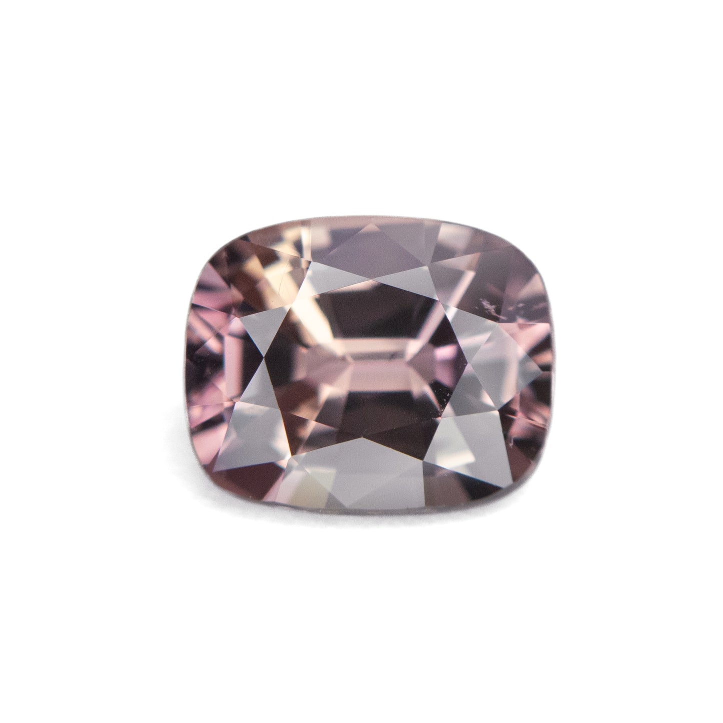 2.05ct unheated antique cushion cut brownish-pink sapphire from Madagascar, loose stone on white background showing faceting and colour