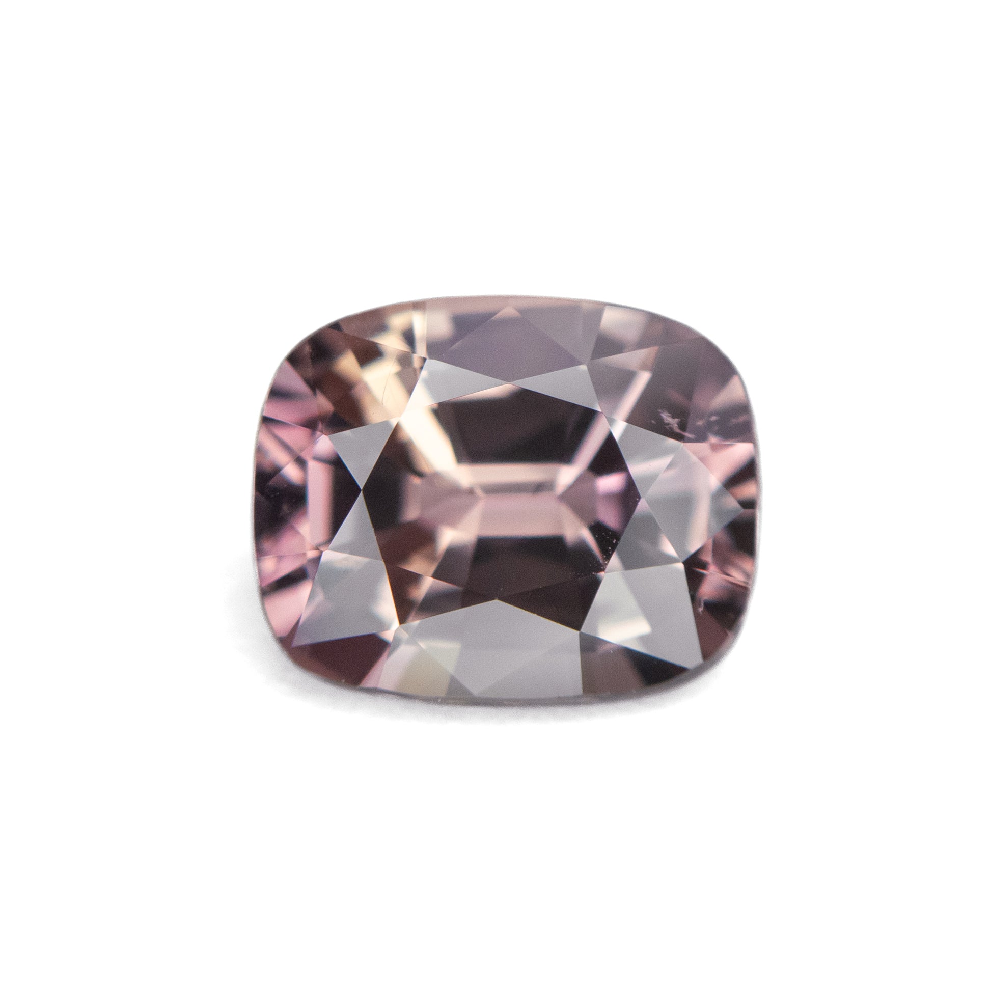 2.05ct unheated antique cushion cut brownish-pink sapphire from Madagascar, loose stone on white background showing faceting and colour