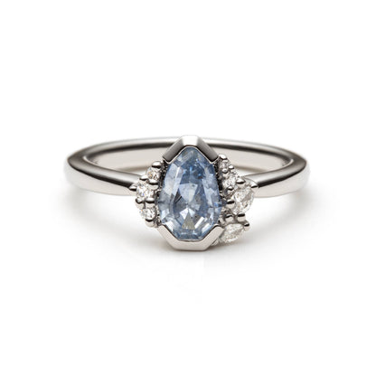 Platinum ring with 1.17ct light blue pear-shaped sapphire and diamond accents