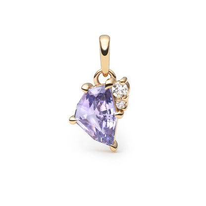 A gold pendant featuring a lavender freeform sapphire and a small cluster of clear round brilliant cut diamonds on the right side, set against a plain white background.