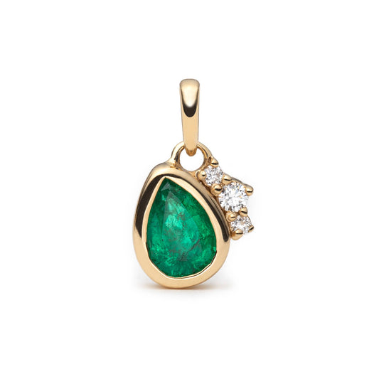 A gold pendant featuring a teardrop-shaped green emerald and a small cluster of diamond accents on the right side, set against a plain white background.