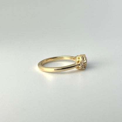 18k yellow gold half-bezel ring featuring purple sapphire with 5 natural diamond accents