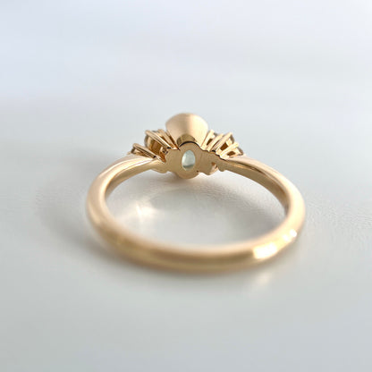 Underside view of a gold ring, to see the half-bwezel and double gallery details. 