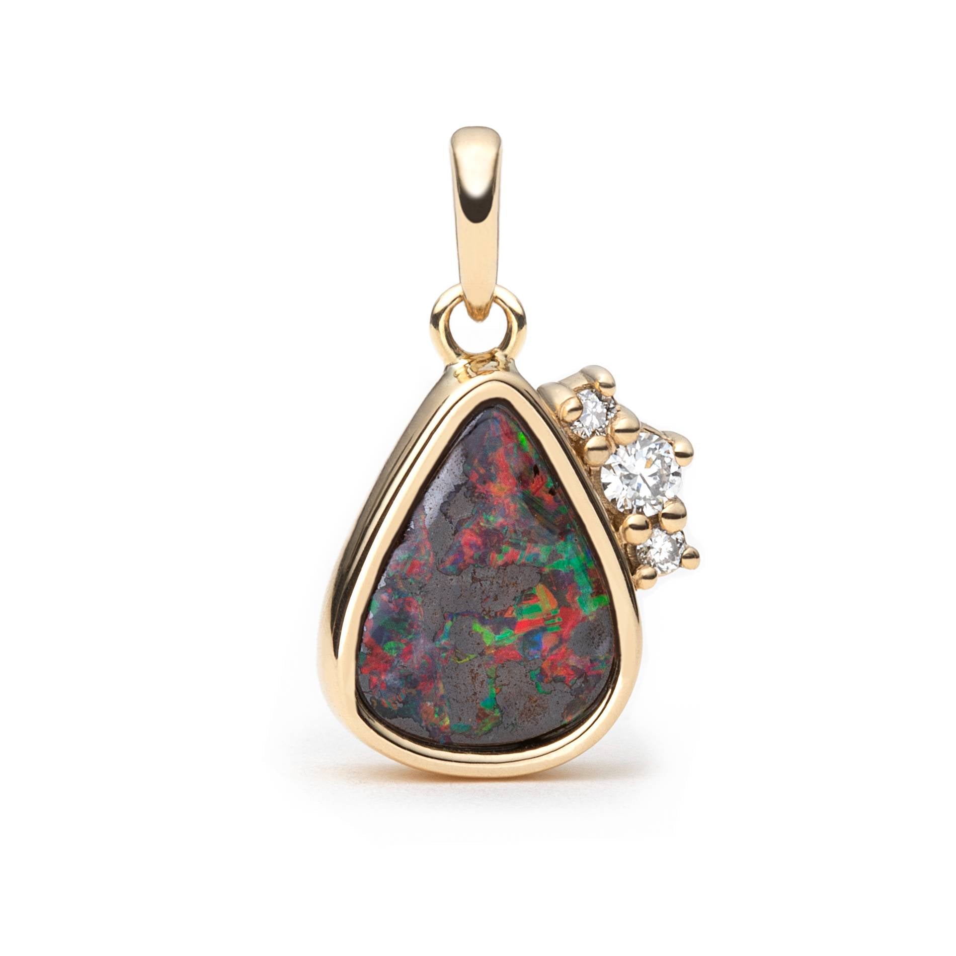 A gold teardrop pendant featuring a colorful boulder opal with green, red, and blue flashes, accented by a small cluster of natural diamonds on the right side, set against a plain white background.