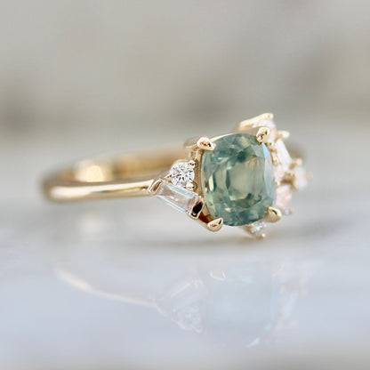 1.47ct unheated cushion cut green Montana sapphire and diamond cluster ring in 14k yellow gold, profile view showing band width and asymmetric diamond setting detail