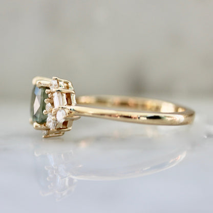 1.47ct unheated cushion cut green Montana sapphire and diamond cluster ring in 14k yellow gold, side view showing asymmetric diamond setting and band profile