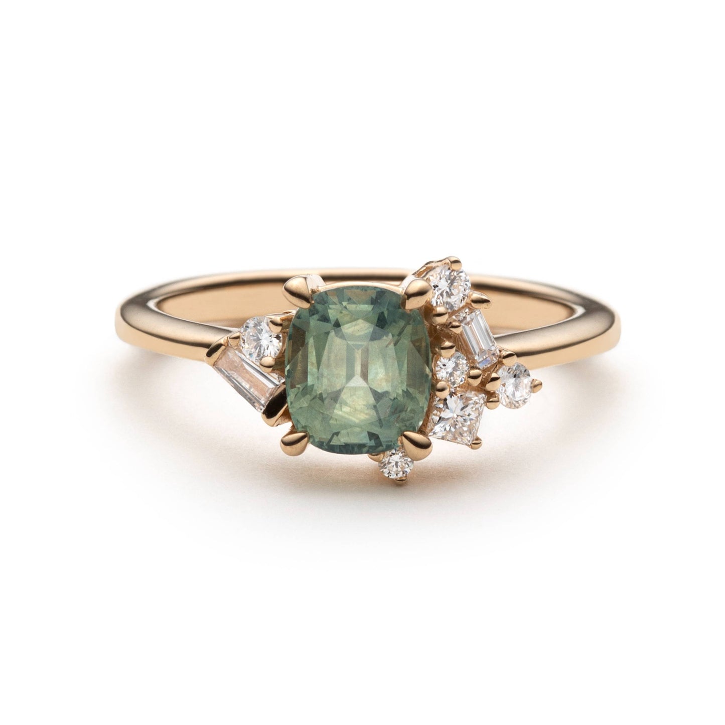 1.47ct unheated cushion cut green Montana sapphire and diamond cluster ring in 14k yellow gold, front view showing asymmetric diamond setting
