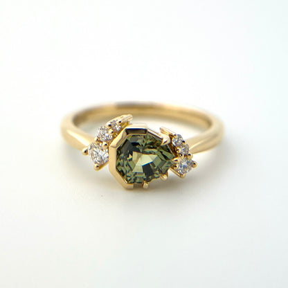 1.27ct unheated geometric trillion cut green Madagascar sapphire and diamond ring in 18k yellow gold, front view showing full setting and diamond accents