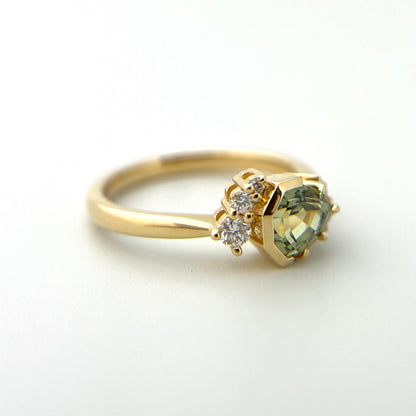 1.27ct unheated geometric trillion cut green Madagascar sapphire and diamond ring in 18k yellow gold, profile view showing band width and half bezel setting detail