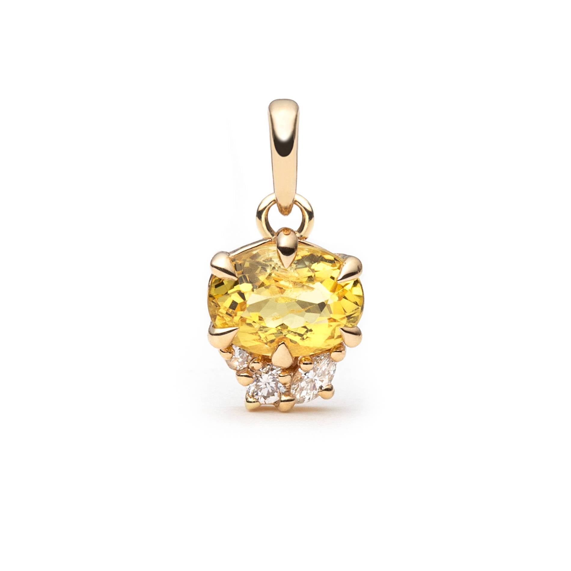 A yellow oval horizontally set heliodore pendant in a gold setting, accented with small clear natural diamonds below, shown on a plain white background.