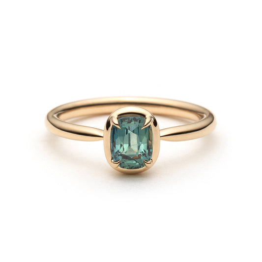 1.10ct elongated cushion cut teal sapphire solitaire ring in 14k yellow gold, front view showing straight band