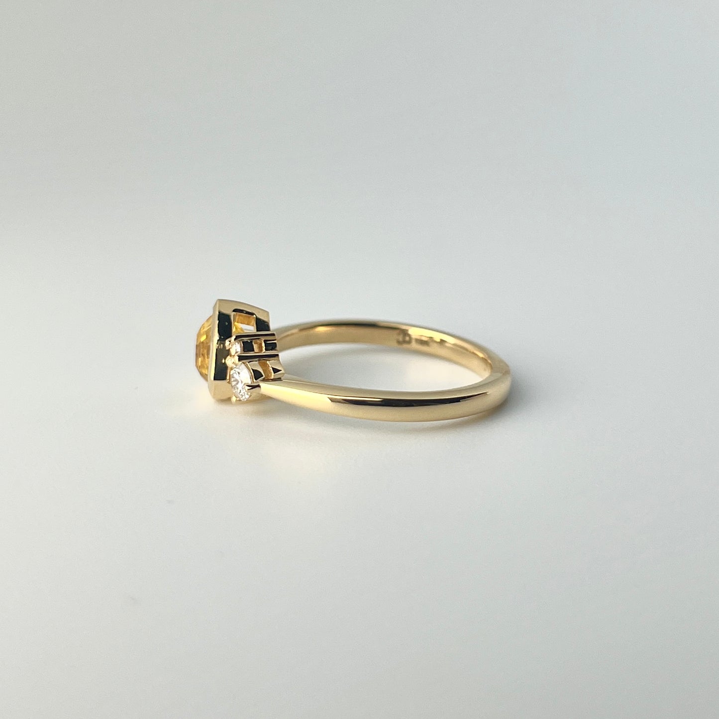1.18ct mixed-cut trillion shaped bright yellow Sri Lankan sapphire and diamond ring in 18k yellow gold, profile view showing band width and setting height