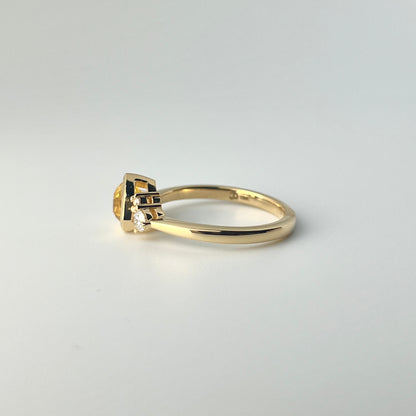 1.18ct mixed-cut trillion shaped bright yellow Sri Lankan sapphire and diamond ring in 18k yellow gold, profile view showing band width and setting height