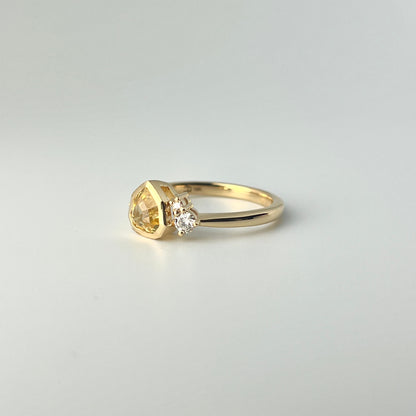 1.18ct mixed-cut trillion shaped bright yellow Sri Lankan sapphire and diamond ring in 18k yellow gold, side view showing bezel setting and band profile